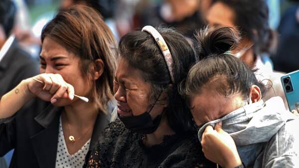 Photos: Thais mourn dozens killed in day care attack