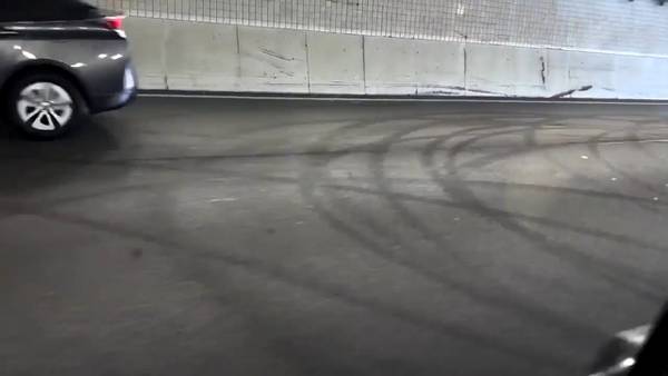 Tire marks visible after cars did donuts in middle of road on I-71 in Cincinnati