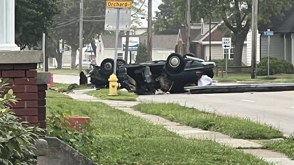 PHOTOS: Busy intersection closed after vehicle overturns in Vandalia