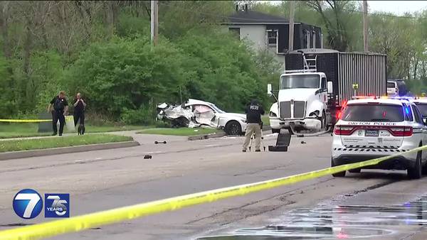 Coroner IDs 2 men killed in crash involving car, semi near Dayton bank