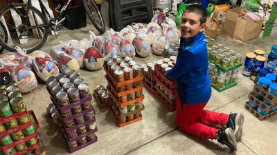 Child trick-or-treats for donations