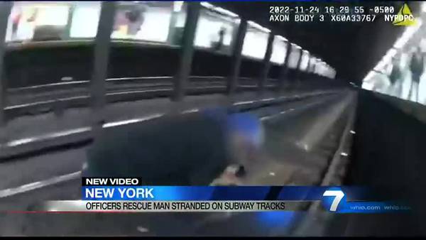 New York City Police rescue a man stranded on the subway tracks