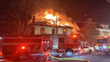 PHOTOS: Flames coming through roof of vacant house fire in Dayton