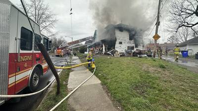 PHOTOS: Firefighters battle house fire in Dayton