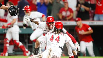 Reds rally to beat Mariners in ninth, lead last NL Wildcard spot by half-game