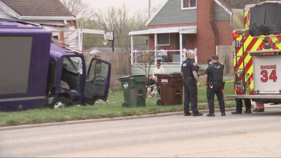 PHOTOS: Advertising truck slams into home in Kettering; driver taken to hospital
