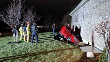 Car crashes into a Troy home