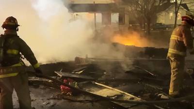 PHOTOS: Firefighters on scene of garage fire in Dayton