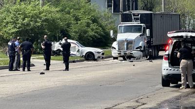 PHOTOS: Coroner on scene of crash involving car, semi near Dayton bank