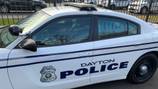 Woman holding baby has legs run over after altercation in Dayton