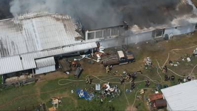 PHOTOS: Firefighters on scene of large barn fire in Miami Township 