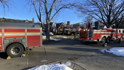 PHOTOS: Firefighters battle Dayton house fire 