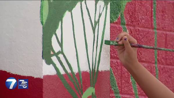 Teens in juvenile justice system paint mural in downtown Fairborn