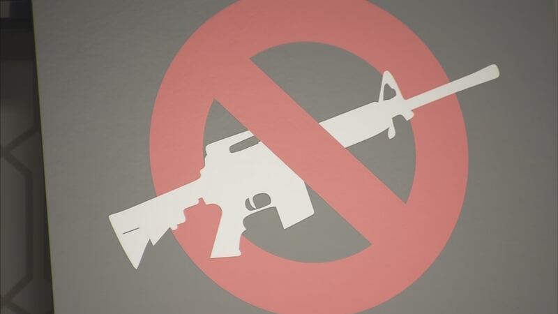 A sign calling for a ban on assault weapons.