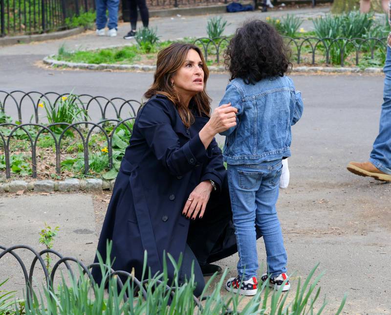 Mariska Hargitay is seen kneeling talking to a child who was really lost in a New York City park.