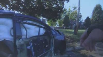 Body cam video shows frightening moments mother crashes during chase with children in car 