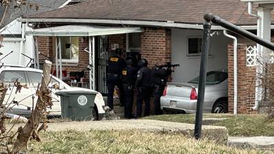 PHOTOS: Police on scene of investigation outside of Dayton house 
