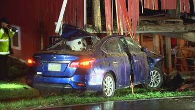PHOTOS: Car crashes into barn in Butler Twp