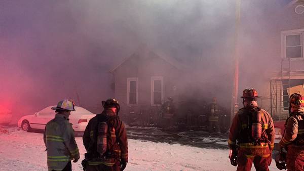 PHOTOS: Crews work to extinguish house fire Monday morning on Hulbert Street in Dayton