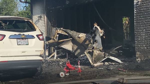 1 injured after house, garage catches fire in Dayton 
