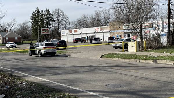 PHOTOS: Police investigate reports of shooting near Dayton grocery store