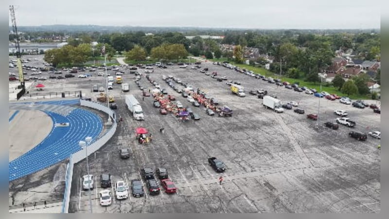 Cars pack fairgrounds for food distribution event