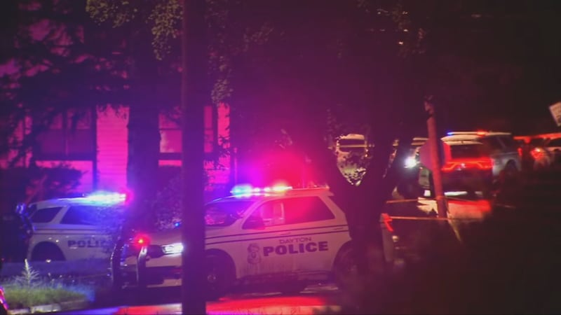 55-year-old man found shot dead in car; woman charged with murder