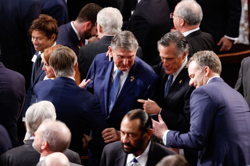 WASHINGTON, DC - MARCH 07: U.S. Sen. Joe Manchin (D-WV) and Sen. Mitt Romney (R-UT) talk prior to the start of President Joe Biden's State of the Union address during a joint meeting of Congress in the House chamber at the U.S. Capitol on March 07, 2024 in Washington, DC. This is Biden’s last State of the Union address before the general election this coming November. (Photo by Chip Somodevilla/Getty Images)