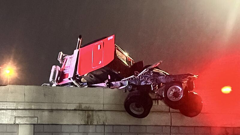 PHOTOS: Semi dangles off ramp from I-75 in Dayton