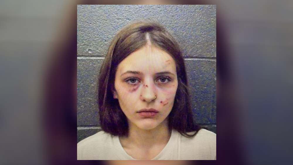 Woman accused of breaking into area house , fighting people inside