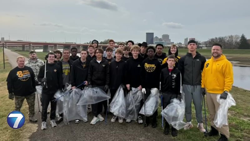 Boys basketball team participates in river clean up