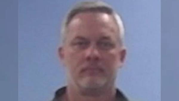 Arkansas high school principal accused of striking wife in throat, killing her