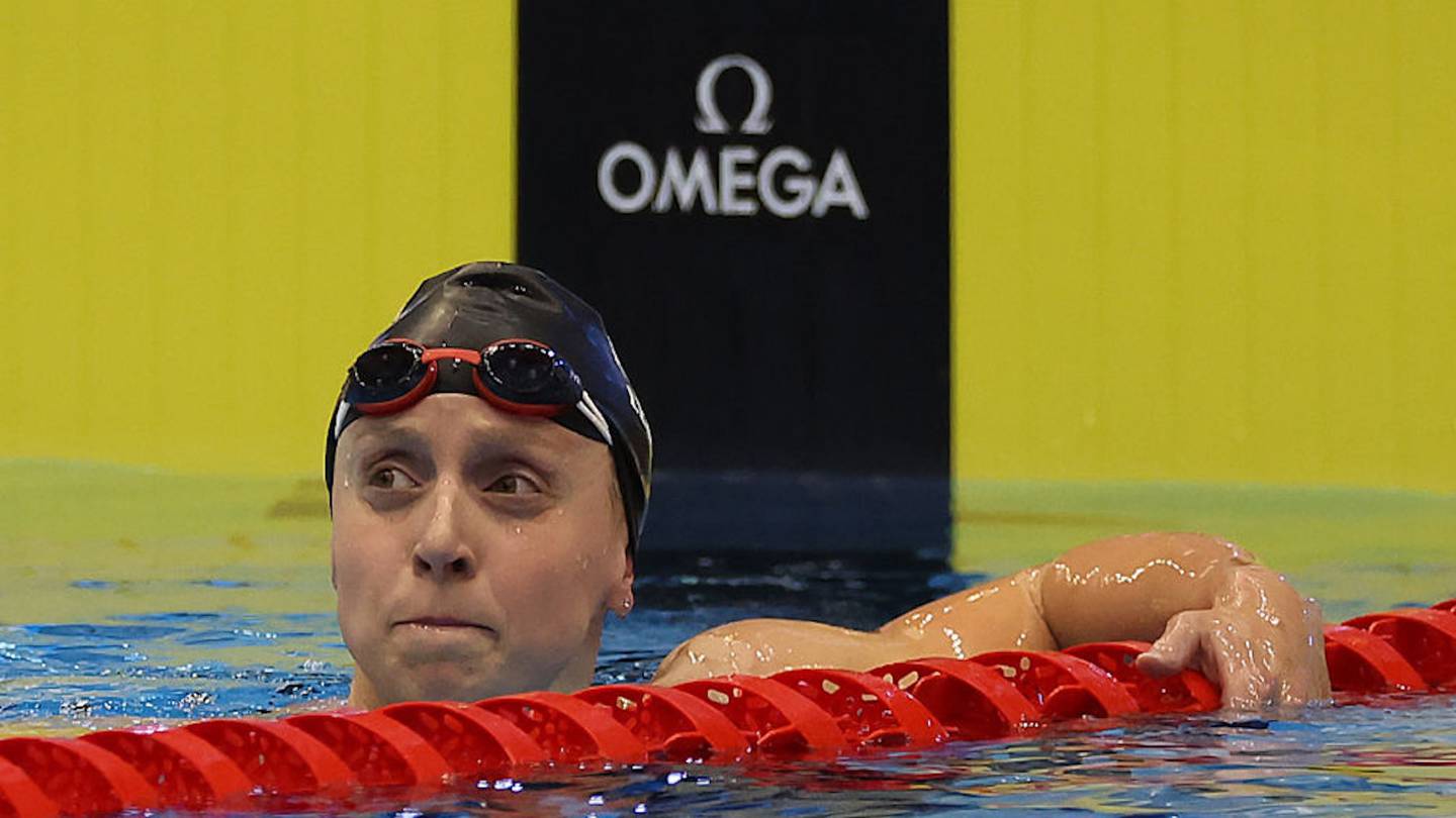 A Young Katie Ledecky Posed for Photos with Michael Jordan and